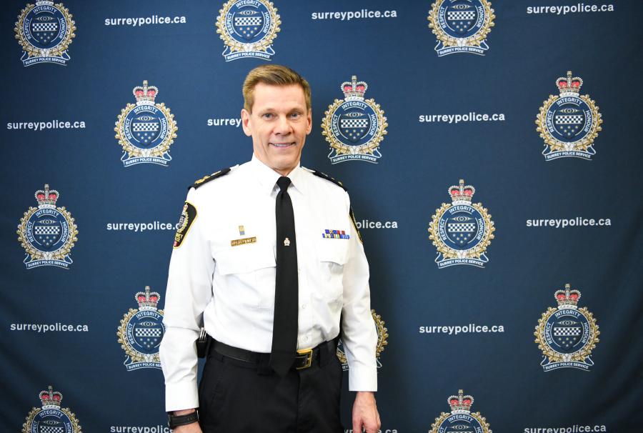 Chief standing in front of the backdrop